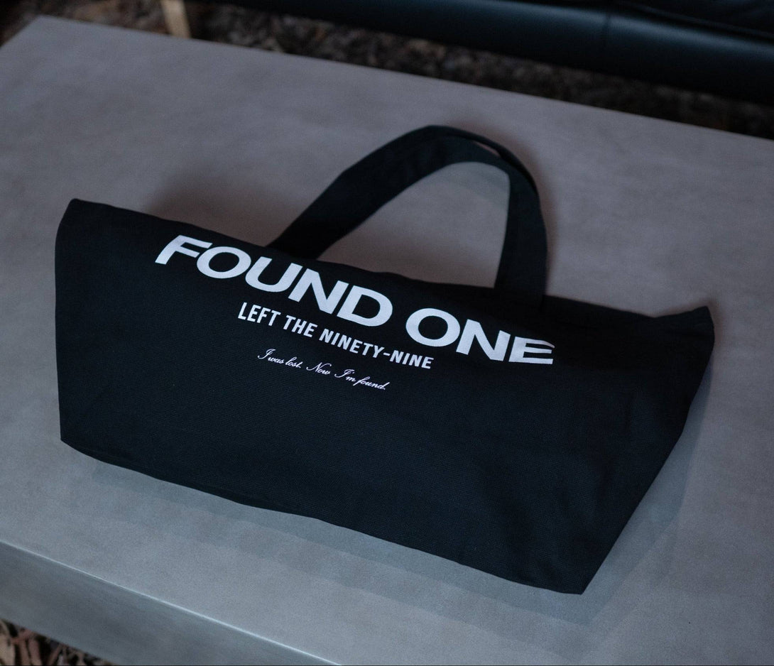 Statement Canvas Tote Bag in black with 'FOUND ONE' text. Made from 100% cotton, this durable and stylish tote is perfect for everyday use.