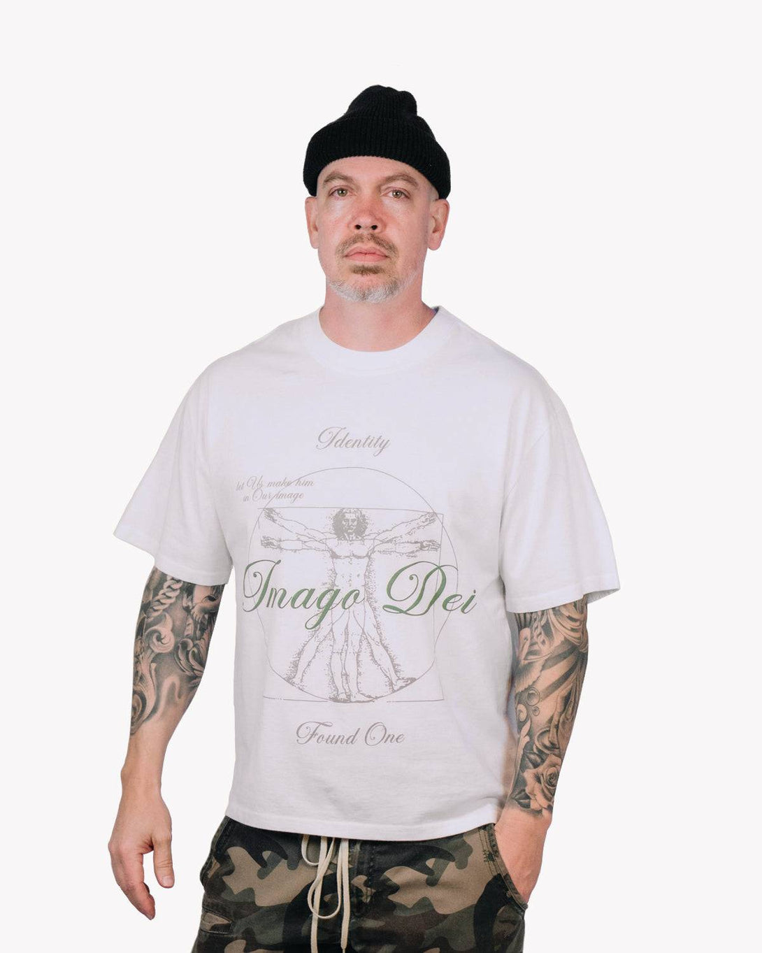 Model wearing the Image of God T-Shirt in Faded White, a relaxed-fit Christian tee with a Vitruvian Man design and 'Imago Dei' text.